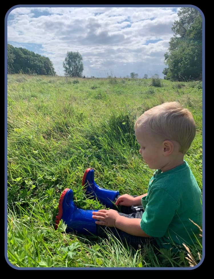 Child sitting in grass